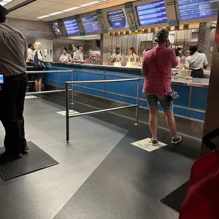 a woman standing in front of a counter