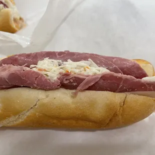 a sandwich with meat and cheese