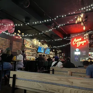people sitting at tables in a restaurant