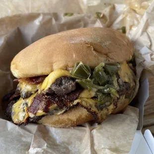 Double cheeseburger with added bacon and green Chiles