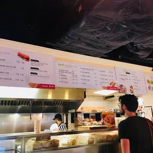 menus on the wall above the counter