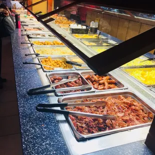 a buffet with a variety of food items