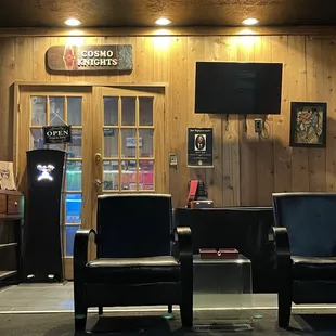 Part of the lounge with the humidor behind the double doors.