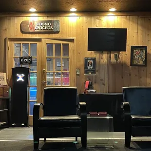 The humidor in the distance and part of the cigar lounge up front.