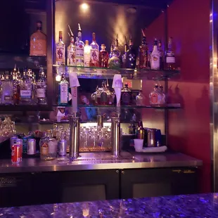 a bar with bottles of alcohol