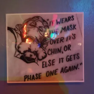 a sign on the wall of a bar