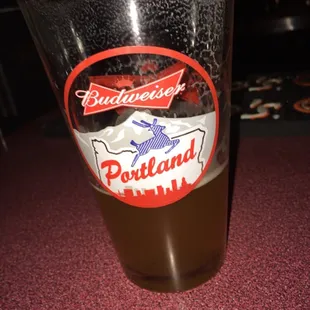 a glass of beer on a table