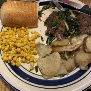 Filet of beef with fried potatoes. Sautéed ramps added on the beef.