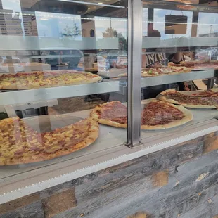 Pizza by the slice available add-ons extra