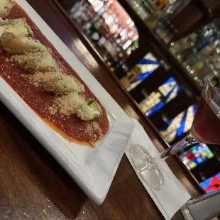 Stuffed zucchini flowers with a manhattan to help wash the down. These fried flowers are so yummy!