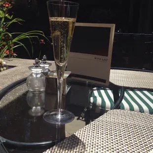 a glass of champagne on a table