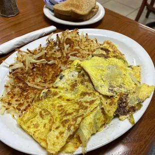 a plate of omelets and hash browns