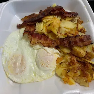 2 Eggs any Style with 3 Piece Bacon and home fries.