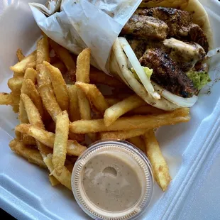 Jerk chicken pita (no tomatoes) with fries and extra sauce. 10/10 recommend.