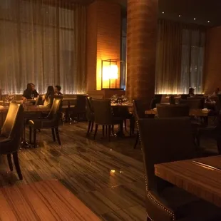 a dining room with tables and chairs