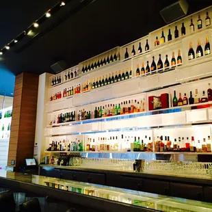 a bar filled with bottles of alcohol