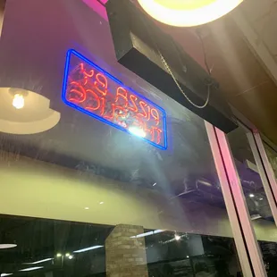 a neon sign in the window