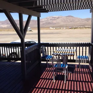 a table and chairs on the deck
