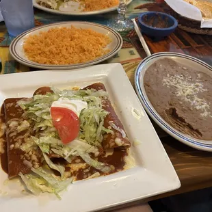 Enchiladas Supreme (4 enchiladas-ground beef, chicken, cheese, bean) with side of beans and rice