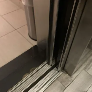 Chipped tile and dirty elevator