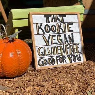 a sign and a pumpkin