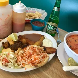 Mariscada (shellfish stew), bean and cheese papusas, plantains and fried yuca. All wonderful!