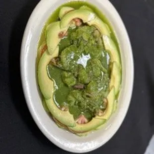 Aguachile is a mouth watering dish lime cured shrimp with a kick of heat and veggies to finish of a bite
