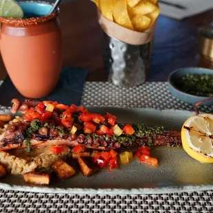 Pulpo a la Parrilla- Grilled Octopus, Plantain Puree, Fried Plantain, Chimichurri, Bell Pepper Curtido