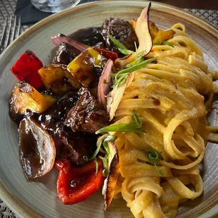 Lomo Saltado- Sautéed Beef Tenderloin, Bell Pepper, Onion, Fettuccine, Huancaina