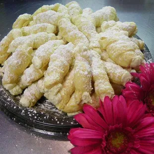 a plate of pastries and a flower