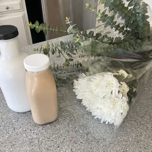 Coconut milk, Keto coffee, and flowers with eucalyptus