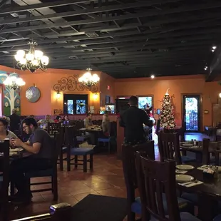 a dining area with people sitting at tables