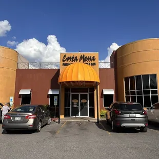 cars parked in front of the restaurant