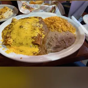 Chicken enchiladas with rice and beans