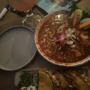 Queso birria tacos and ceviche with a prickly pear margarita
