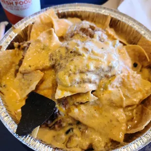 Nachos with all the meats all the beans and all the cheeses. What have I done?