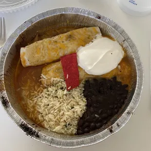 Sweet Pork Enchilada (2) side of rice and beans topped with sour cream and their signature red chip