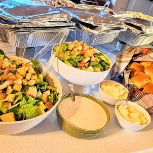 Cesar salad and dinner rolls with whipped butter