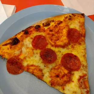 Pepperoni pizza slice.
