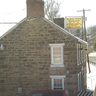 a red car parked in front of it