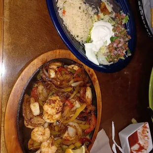 Shrimp fajitas with refried black beans and rice.  Large portion of shrimp and veggies.