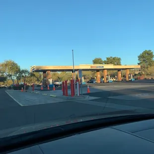 a gas station with a gas station in the background