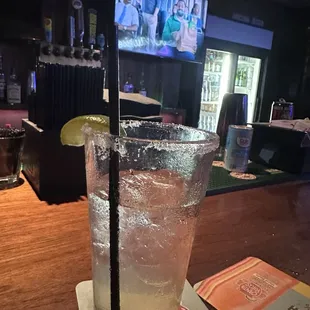 a glass of water with a slice of lime
