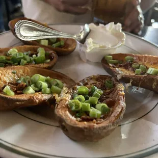 Various appetizers (tater skins, buffalo wings, and redneck nachos) from #Costellos