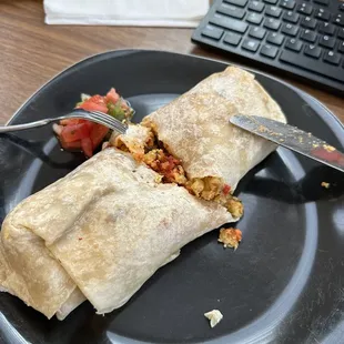 Handheld breakfast burrito to go.