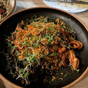 Squid ink bucatini with tomato cream and calamari