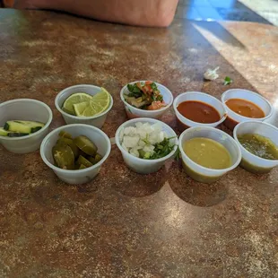 a variety of condiments on a table