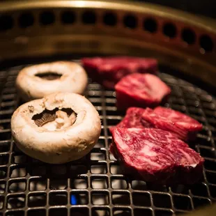 The Butcher's Feast meat plate - 4 cuts of steak, beef fat, 3 types of salt, mushrooms and rice cakes.