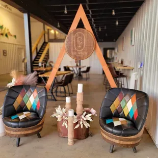 two chairs and a table in the tasting room