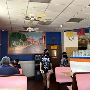 a woman standing in a restaurant